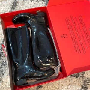 Tall black hunter boots, size seven women.